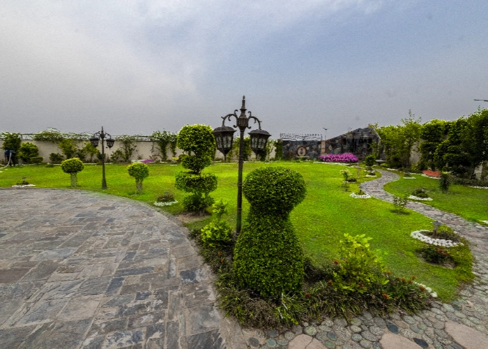 Beautiful landscaped garden with pathway and greenery in Islamabad, ideal outdoor location for creative brand photoshoots