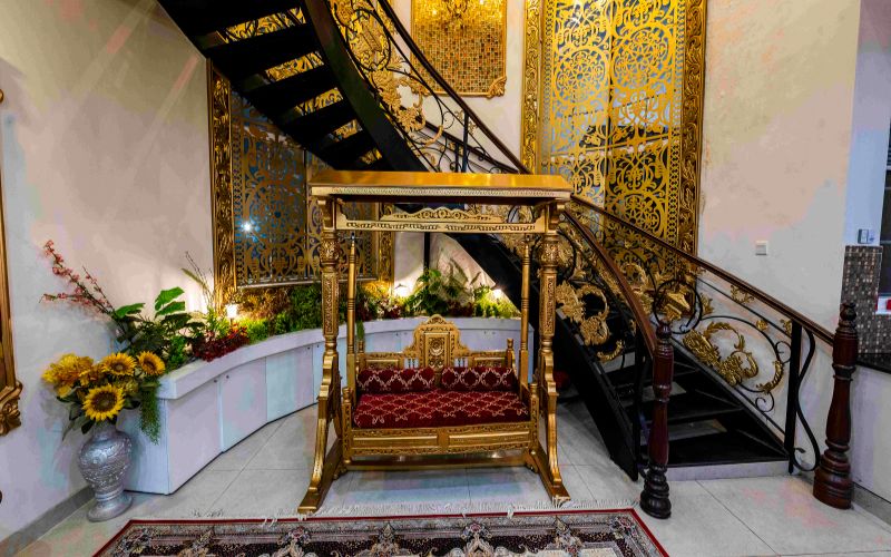 Luxury indoor swing setup with ornate décor, ideal backdrop for an elegant engagement photoshoot at AH Royal Resort